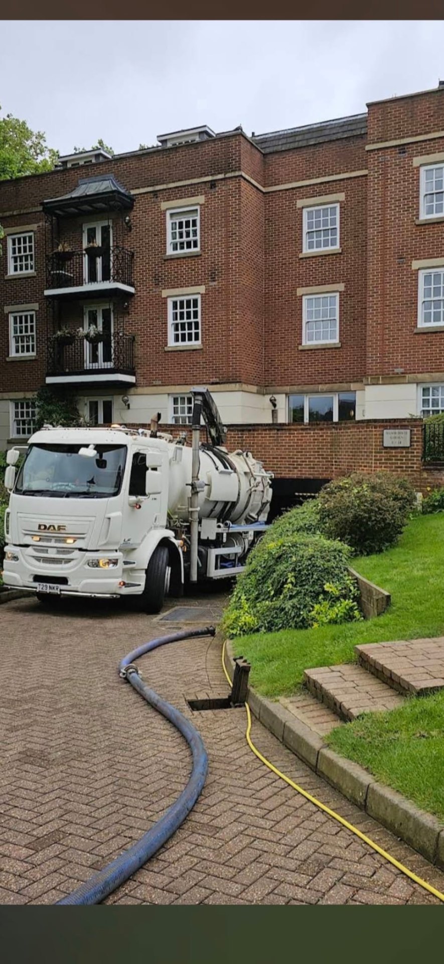 DAF tanker on a residential development carrying out bulk waste removal and drain emptying